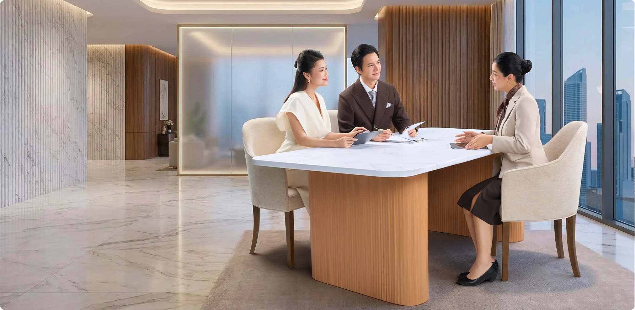 Two wealth advisors discussing at a desk